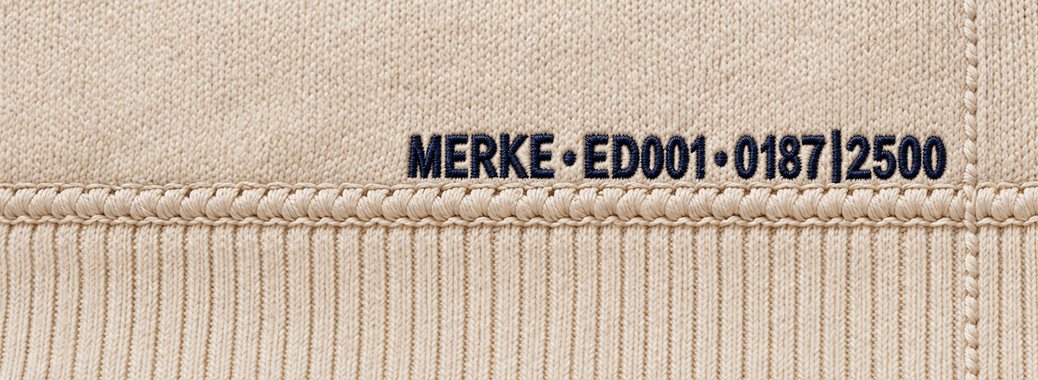 MERKE•ED001•0187|2500 embroidered in deep navy directly against the lower waistband joining seam, with tonal side-seam stitching to the right